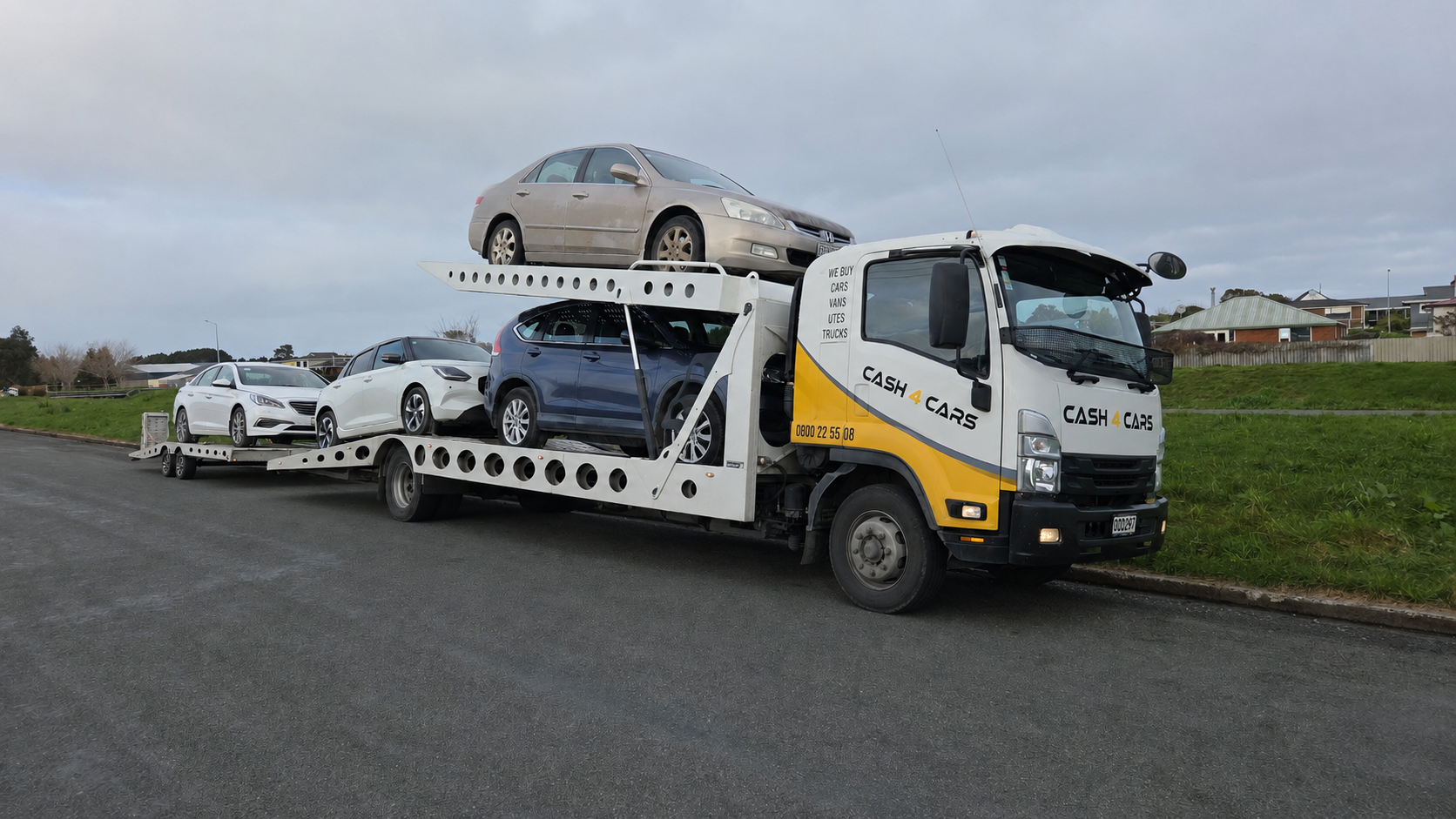 Cash 4 Cars transporter carrying vehicles in Southland
